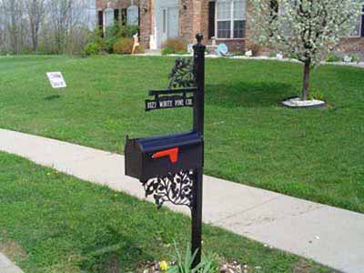 Wrought iron mailbox post with vines