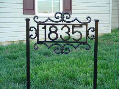 Self standing wrought iron house numbers with scroll work