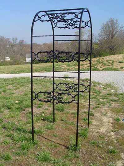Wrought iron arbor with ornament 