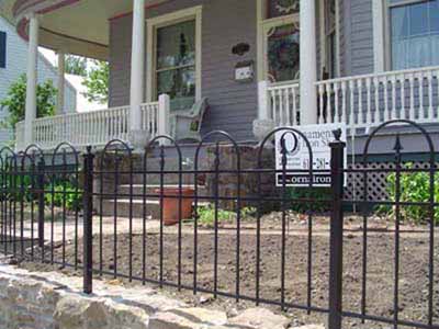 Garden fence with custom loops over spears