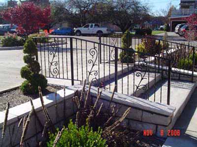 Wrought iron stair railing with internal scroll ornaments